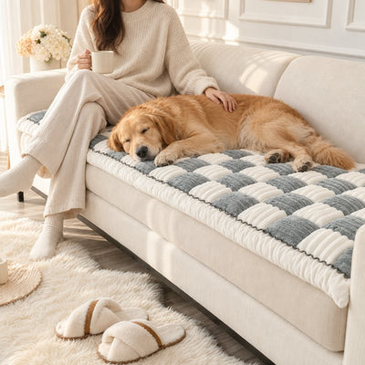 Golden Retriever asleep on a Gray Team K9 couch cover beside its owner