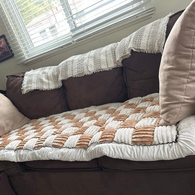 Customer photo from Elizabeth J.: a Beige Team K9 couch cover on a dark sofa