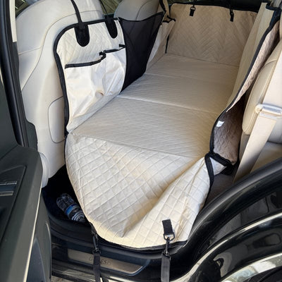 Customer photo from Christine F.: a Beige Team K9 seat cover installed in an SUV