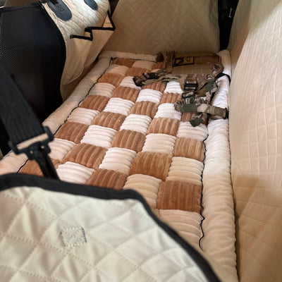 Customer photo from Melissa G.: a Beige Team K9 seat cover in her mid-size SUV