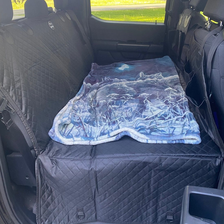 Customer photo from Kenneth M.: a Black Team K9 seat cover installed in a truck