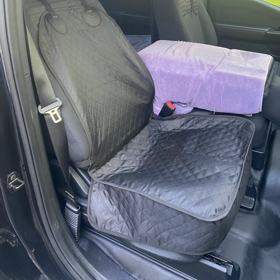 Black Team K9 single-seat cover on the front seat of a pickup truck